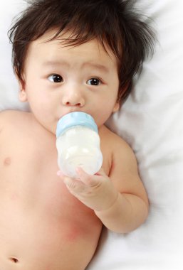 Baby drinking milk clipart