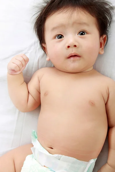 Bebé en la cama —  Fotos de Stock