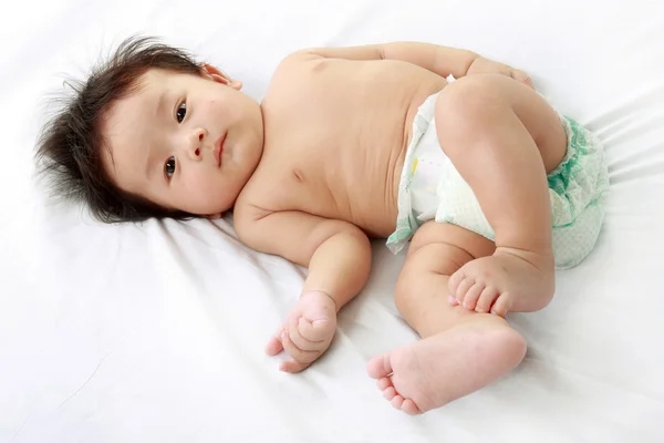 Baby on bed — Stock Photo, Image