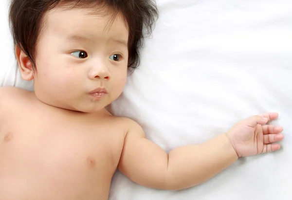 Baby laying in the bed. — Stock Photo, Image