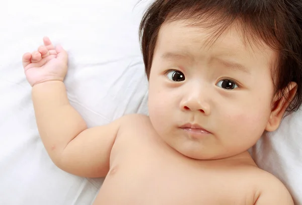 Baby laying in the bed. — Stock Photo, Image