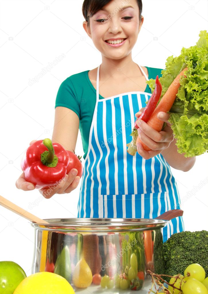 Woman putting a bunch of healthy ingredients