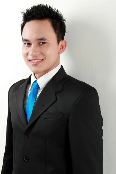Closeup portrait of a happy young asian man smiling — Stock Photo, Image