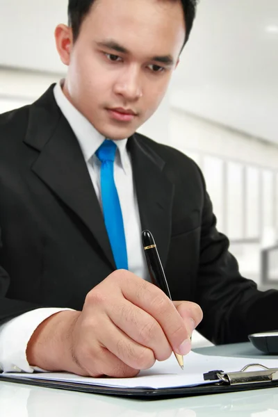 Young business man writing