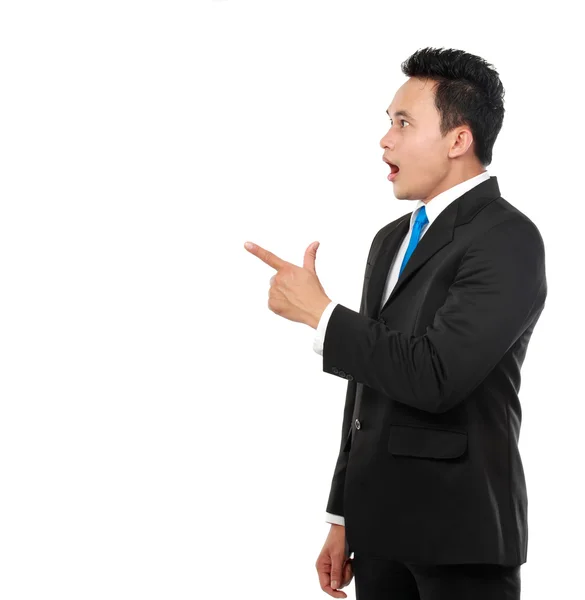 Business man surprisingly pointing at something — Stock Photo, Image