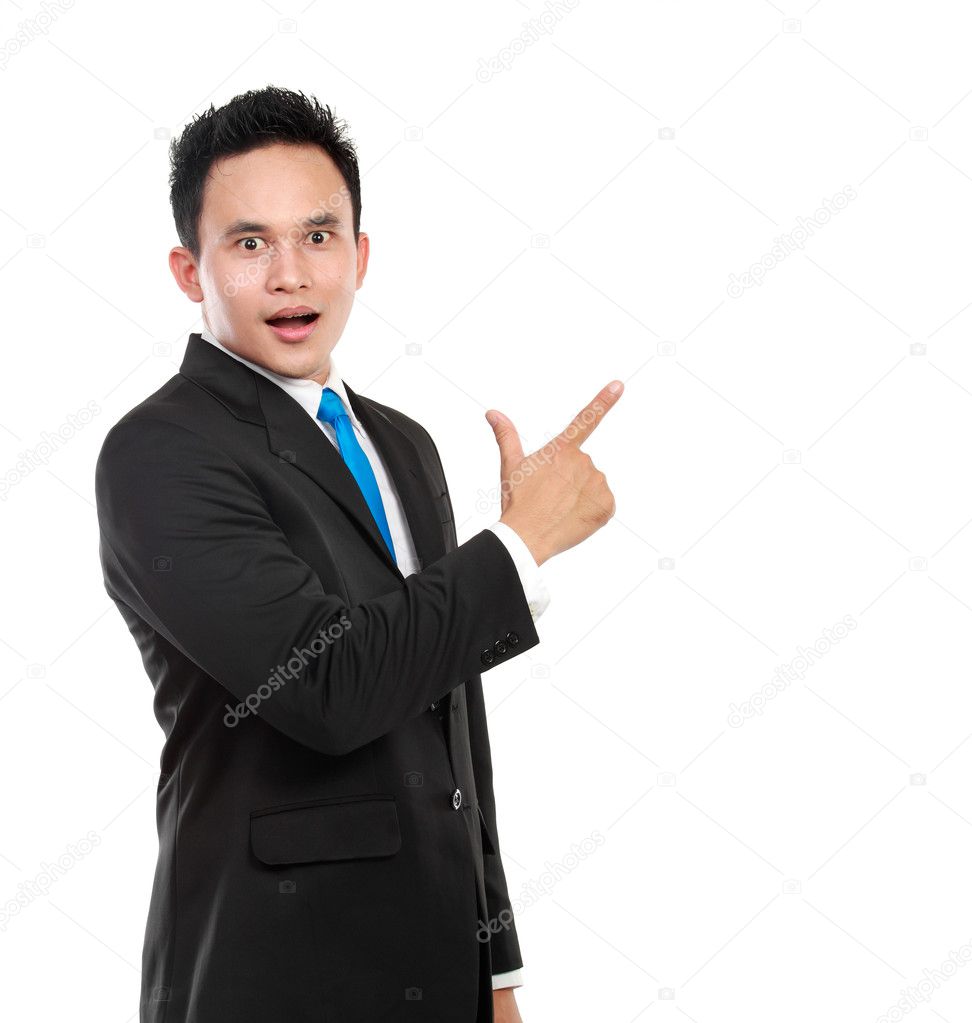 Business man surprisingly pointing at something