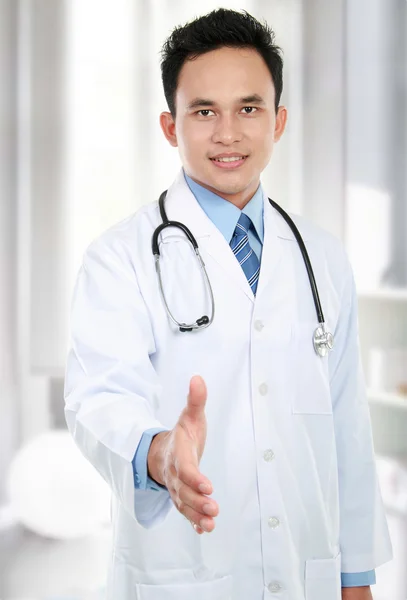 Doctor giving hand for handshake — Stock Photo, Image