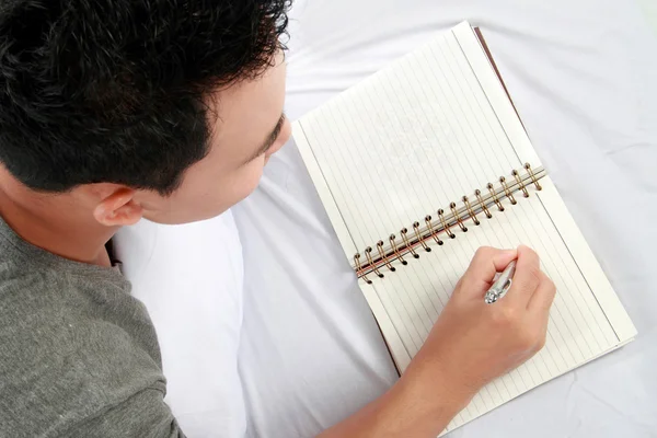 Asian male with his diary Stock Photo