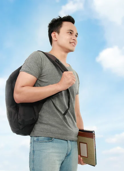 Collegestudent med bok och väska — Stockfoto