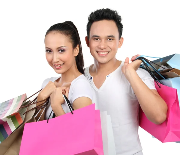 Happy couple with shopping bag — Stock Photo, Image