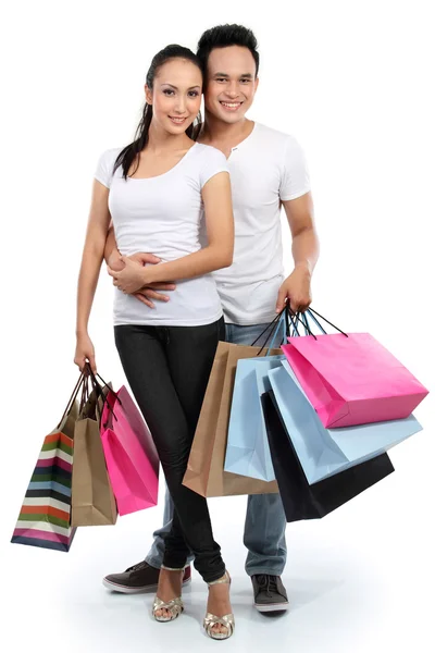 Atractiva pareja con bolsa de compras —  Fotos de Stock