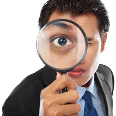 Businessman with magnifying glass clipart