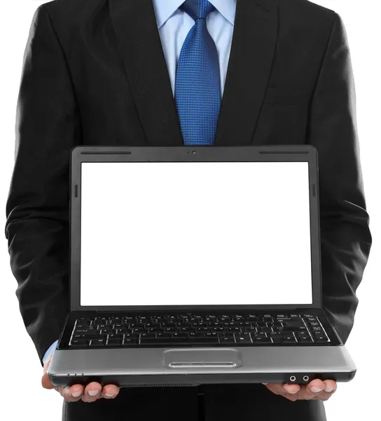 Uomo d'affari che presenta laptop vuoto — Foto Stock