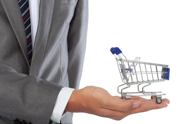 Hand and shopping cart — Stock Photo, Image