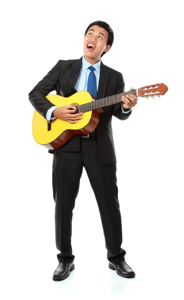 Zakenman spelen gitaar — Stockfoto