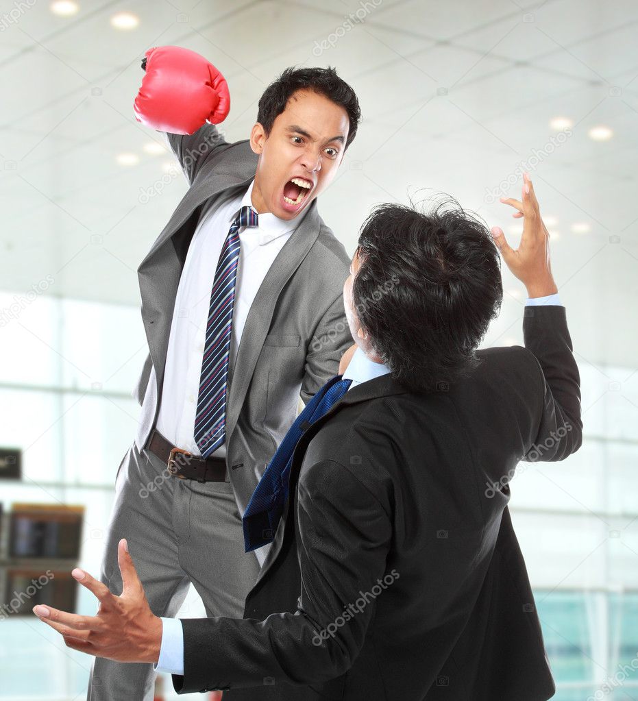 Businessmen fighting