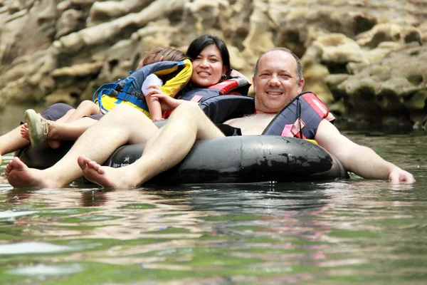 Family on inflatable tube — Stock Photo, Image
