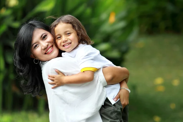 Cute cheerful child with mother — Stock Photo, Image