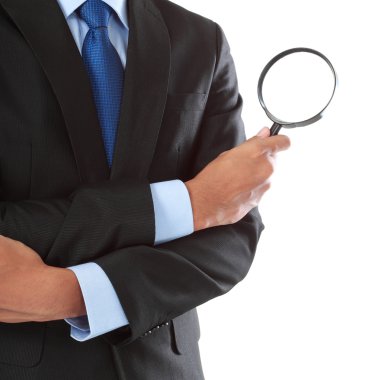 Businessman with magnifying glass clipart
