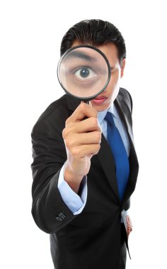 Businessman with magnifying glass clipart