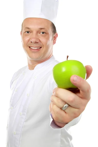 Mężczyzna kucharz z jabłkiem — Zdjęcie stockowe