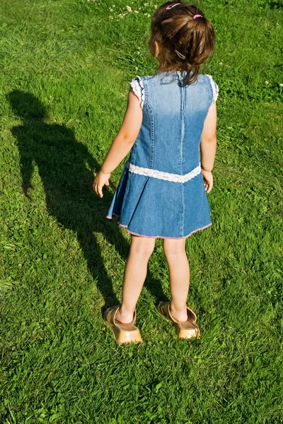 Little girl with slip-on — Stock Photo, Image