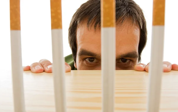 Man peeping from behind the table — Stock Photo, Image