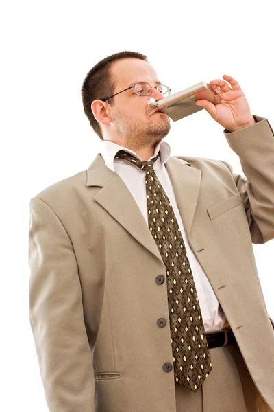 Businessman drinking from a flask — Stock Photo, Image