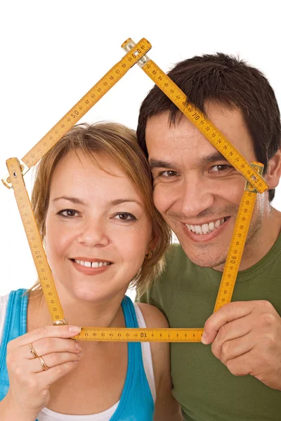 Couple with model house — Stock Photo, Image
