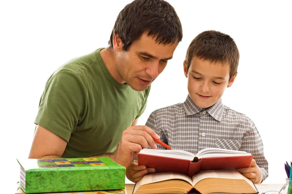 Школьник и его отец учатся Стоковое Фото
