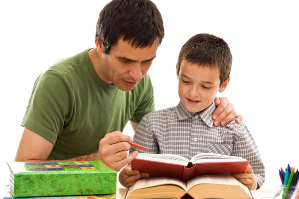Skolpojke och hans far lärande — Stockfoto