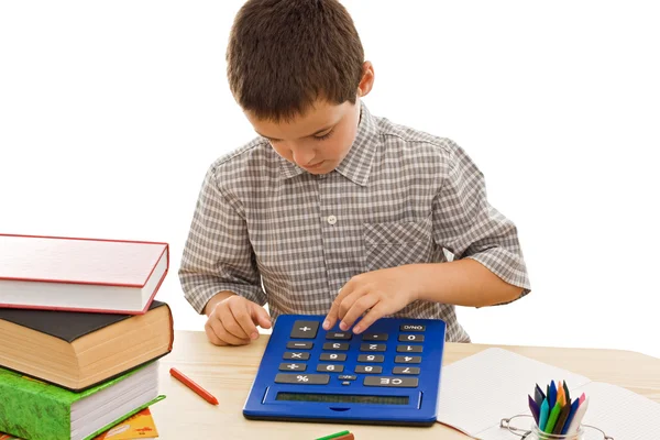 Школьник с калькулятором — стоковое фото