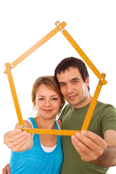 Couple with model house — Stock Photo, Image