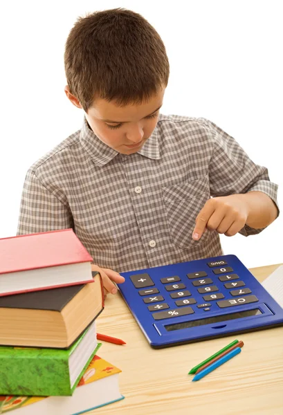 Школьник с калькулятором — стоковое фото