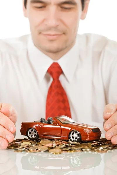 Geschäftsmann mit rotem Spielzeugauto — Stockfoto