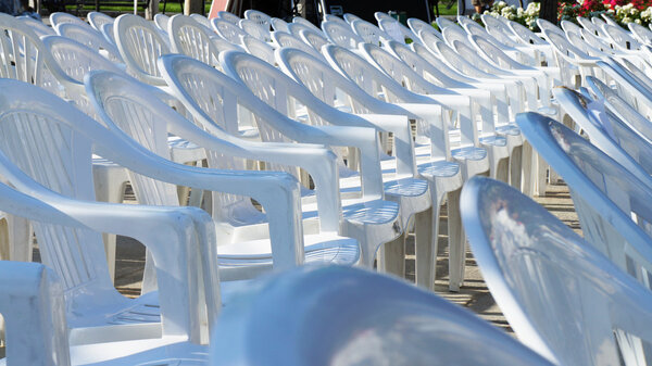 Empty white chairs