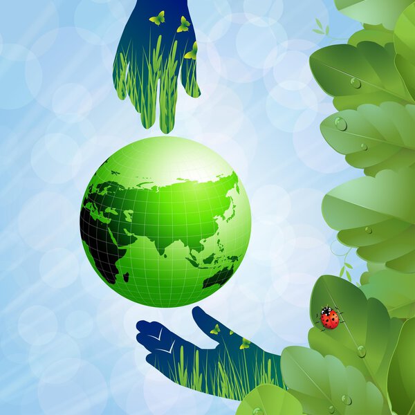 Руки держат зеленую землю

