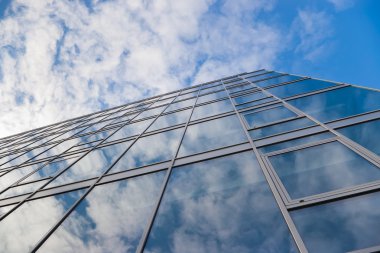 Building with clouds reflection clipart