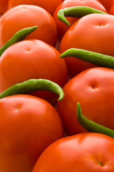 Tomatoes and peppers background — Stock Photo, Image
