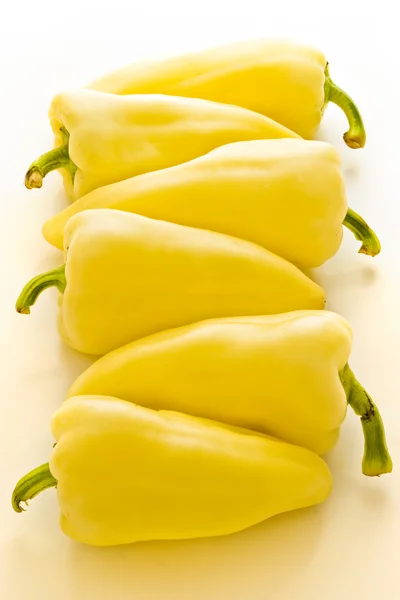 Six yellow peppers — Stock Photo, Image