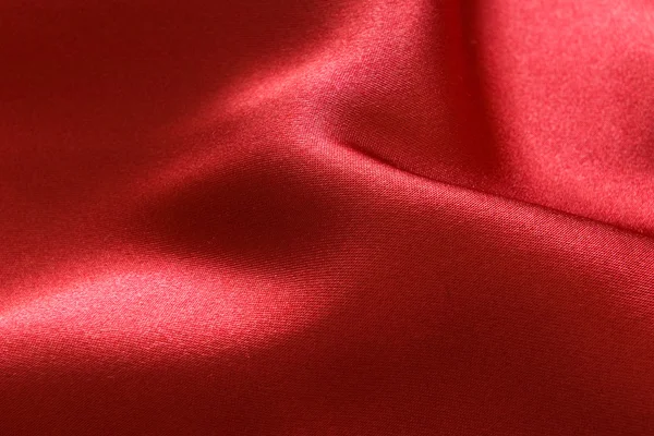 Красный атласный фон — стоковое фото