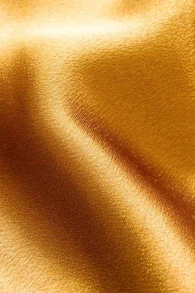 Gouden golvende stof — Stockfoto