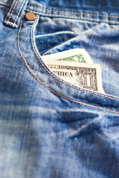 One dollar in jeans — Stock Photo, Image