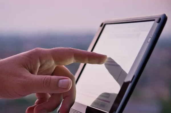 Touching screen on tablet — Stok fotoğraf