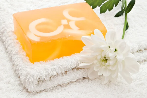 Yellow soap on towel — Stock Photo, Image