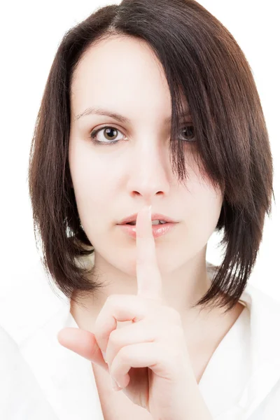 Brunette Woman Holding a Finger on Her Lips — Stock Photo, Image
