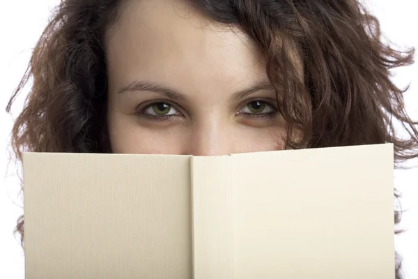 Skeptisk tjej med bok — Stockfoto