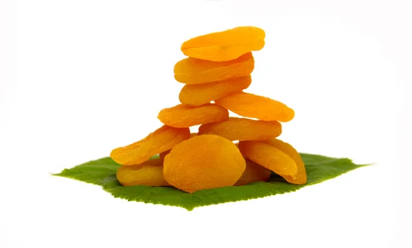 Dried apricot with green leaves isolated on white background — Stock Photo, Image