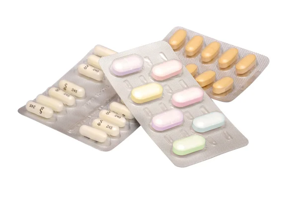Pillole di medicina multicolore sullo sfondo bianco — Foto Stock