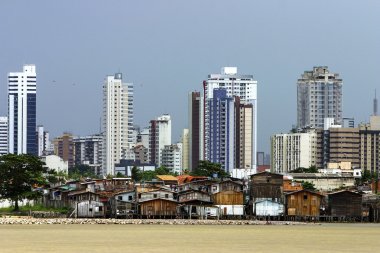 Modern buildings and palafitte slum clipart